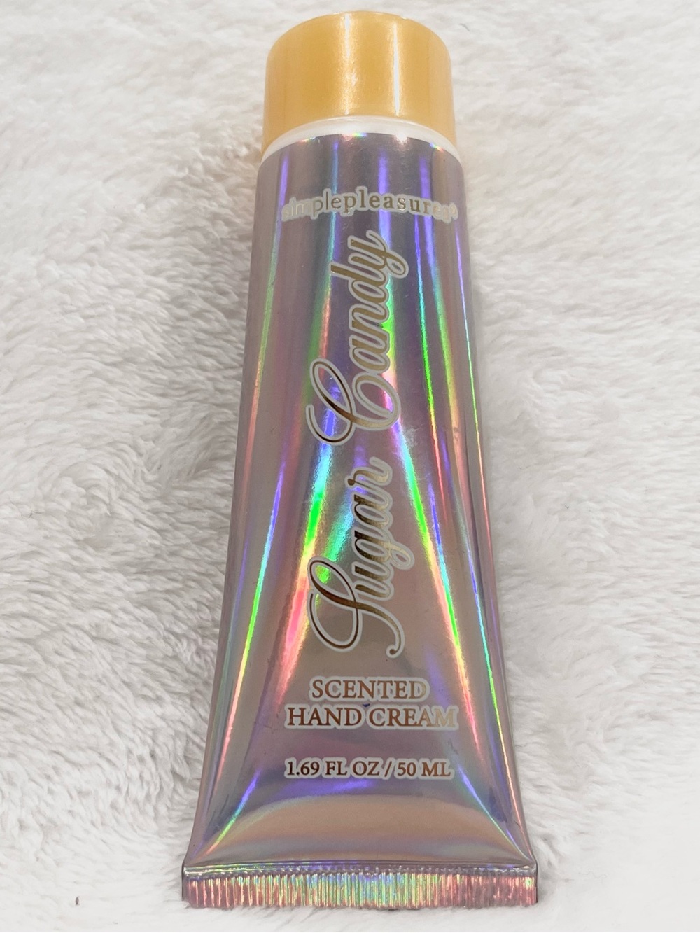 Simple Pleasures "Sugar Candy" scented hand cream in a 1.69 FL OZ